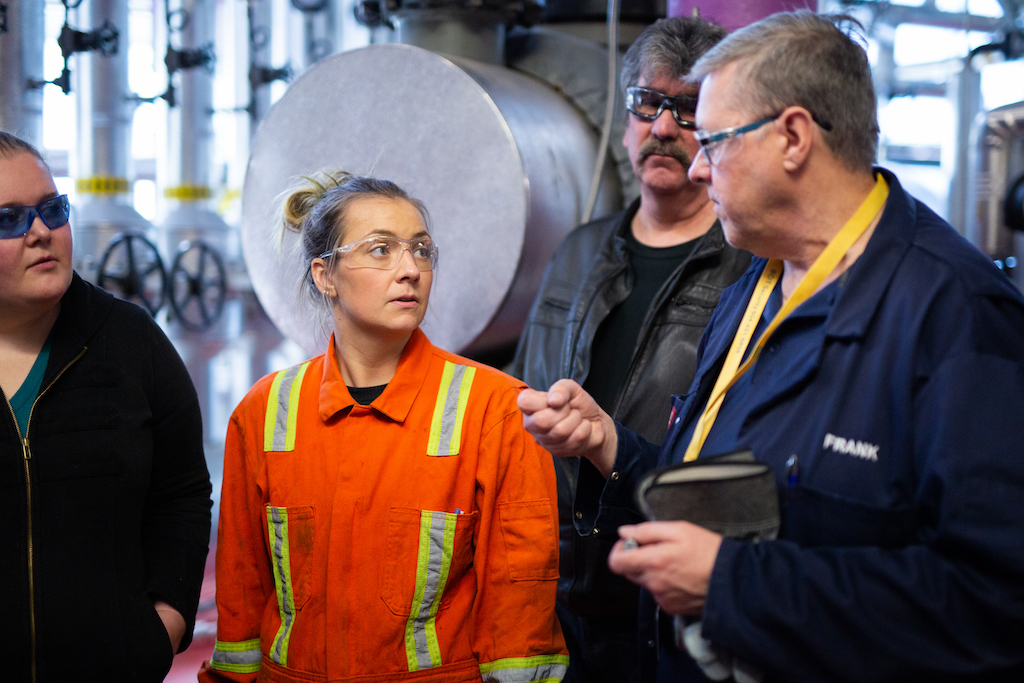 Team of LNG Canada workforce collaborating on the project