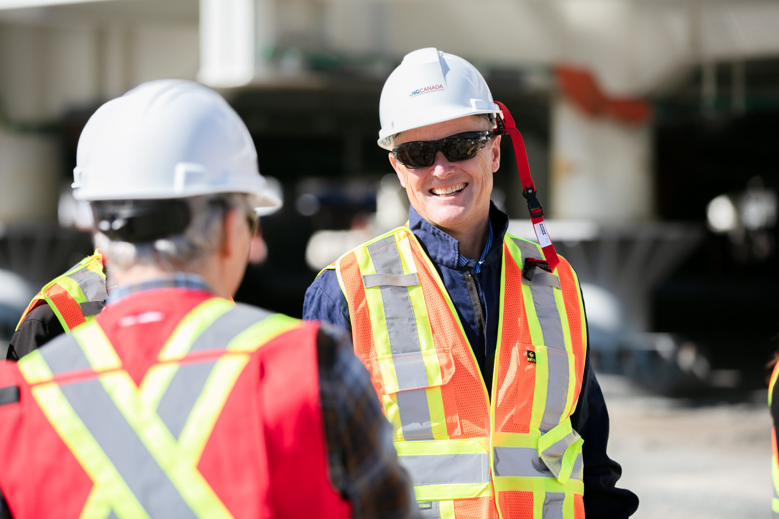 LNG Canada project employees engaging in positive conversation at work
