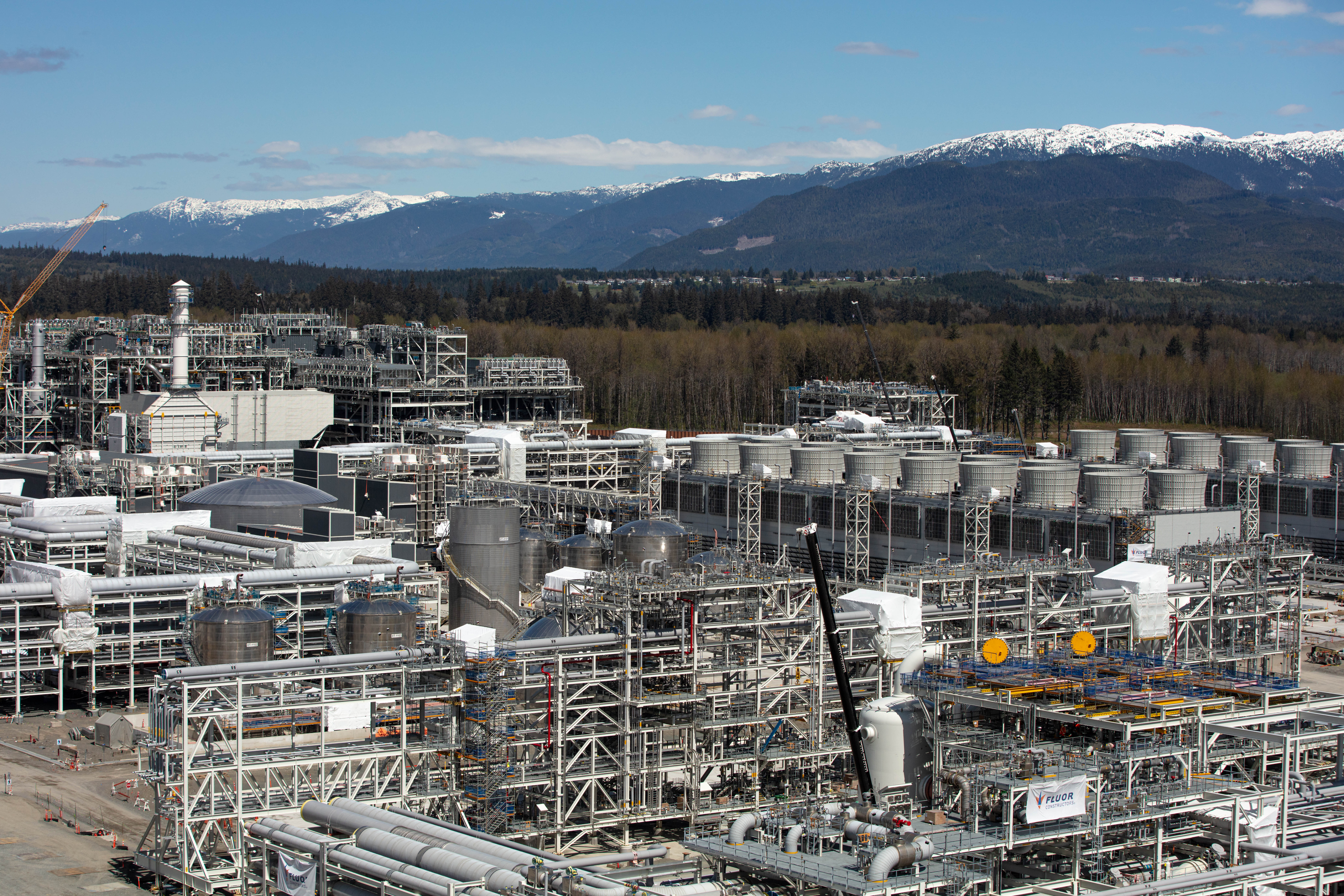 Liquefied natural gas pipelines and equipment at the LNG Canada site, showcasing infrastructure and operations